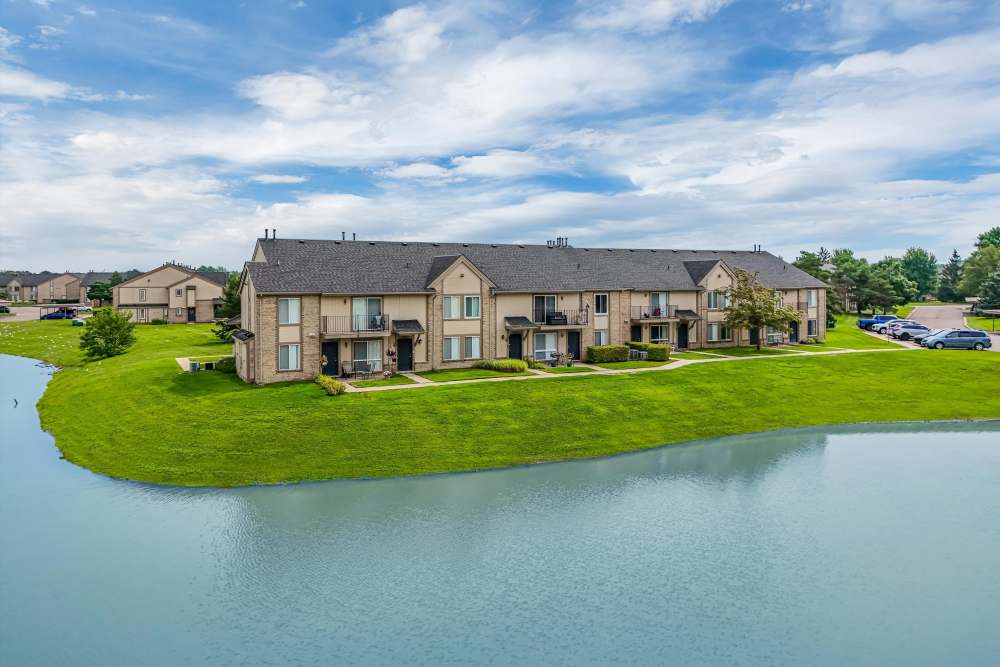 View of apartment building by the lake at Lakeside Terraces in Sterling Heights, Michigan