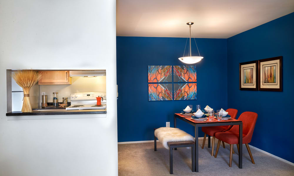 Kitchen pass-through window and dining room of a model apartment at Lakeside Terraces in Sterling Heights, Michigan