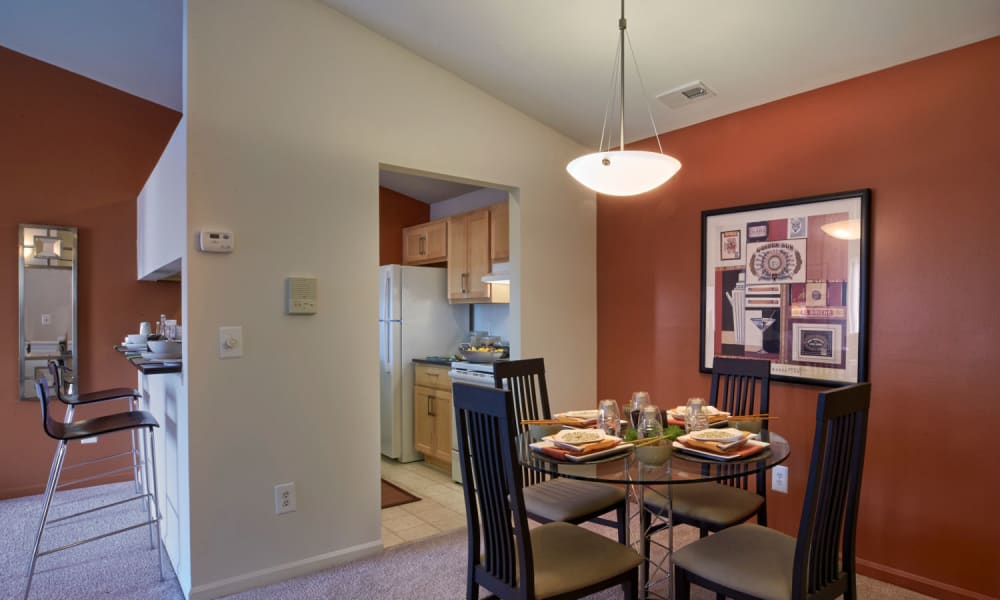 Dining room table and pendant lighting at Lakeside Terraces in Sterling Heights, Michigan