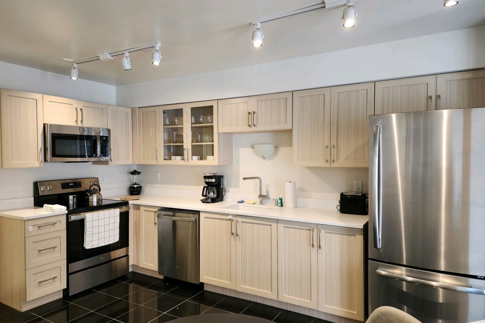 Modern kitchen with stainless steel appliances at Lakeside Terraces in Sterling Heights, Michigan