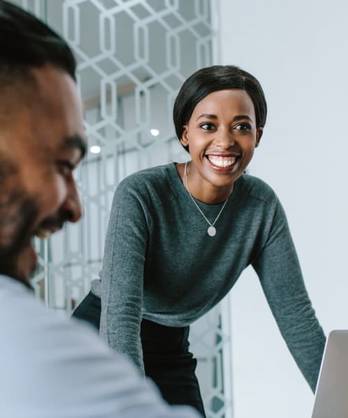 Beztak Properties professional leading a team meeting 